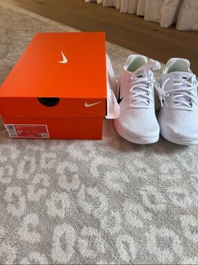 Nike White Athletic Sneakers with Black Swoosh